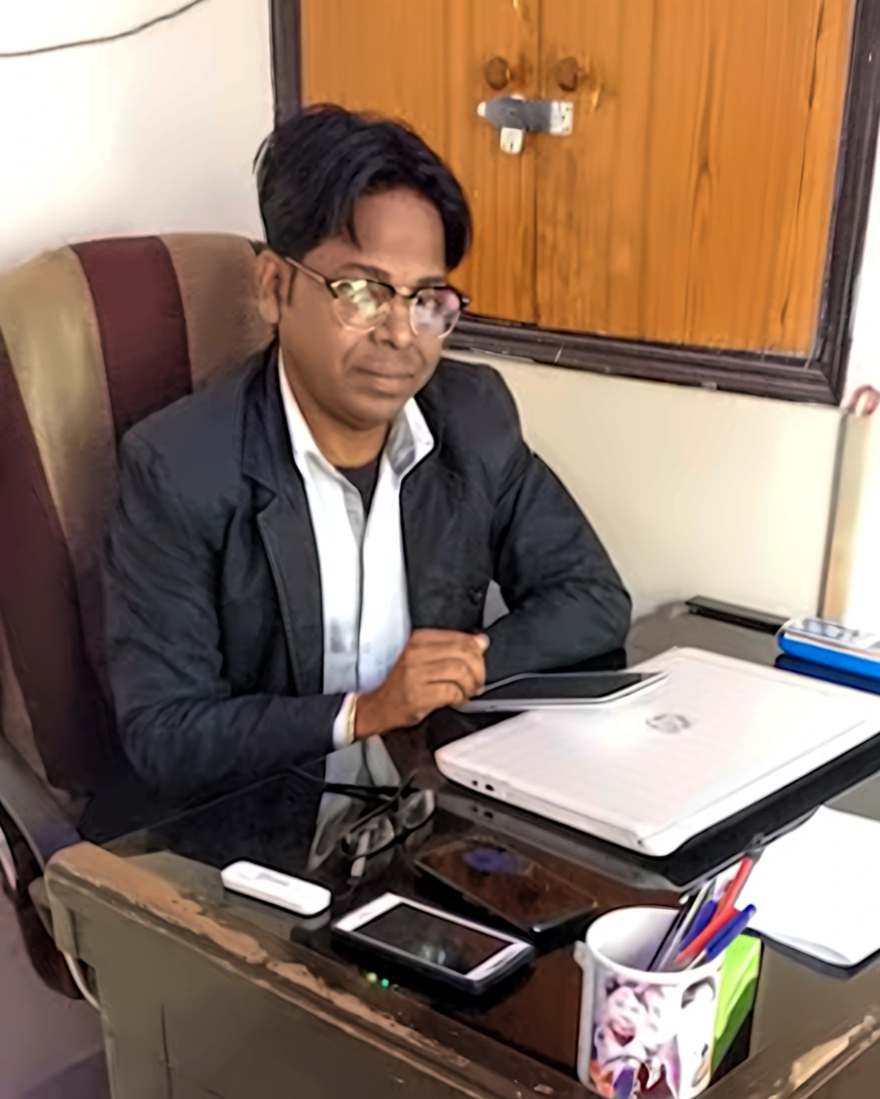 Founder of SK Institute at his office desk