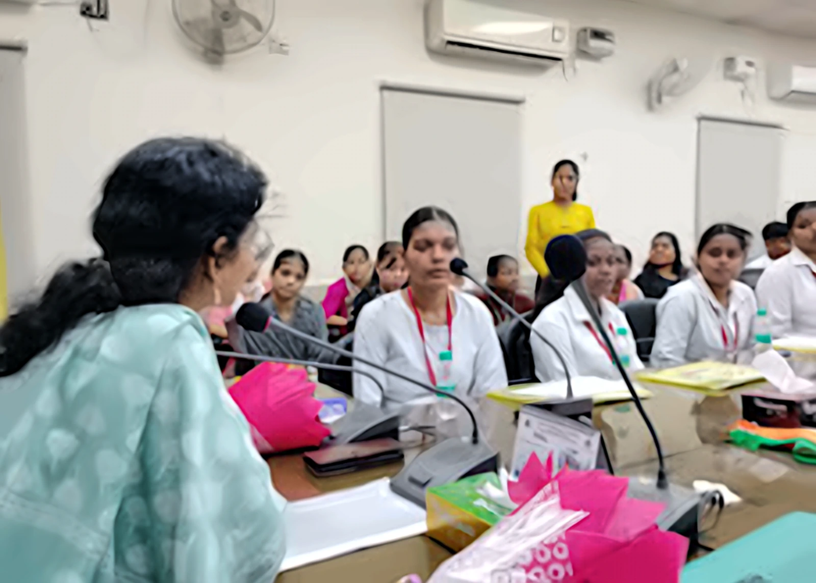 SK Institute faculty member guiding students during a class